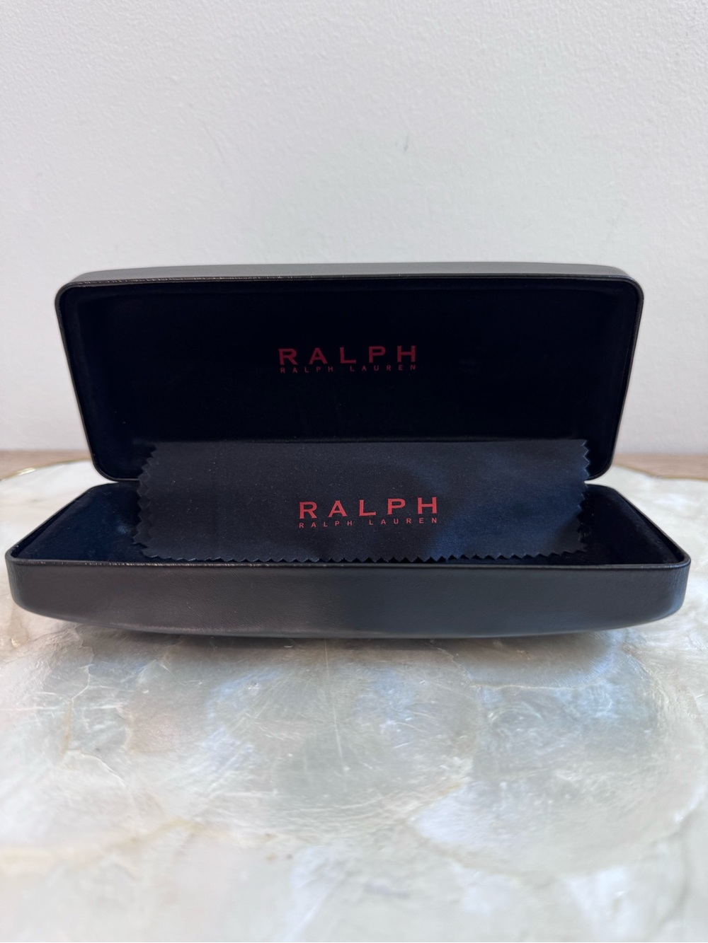 Ralph Lauren black Hard-shell clamshell eyewear case with a red logo